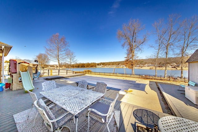 wooden deck with a water view