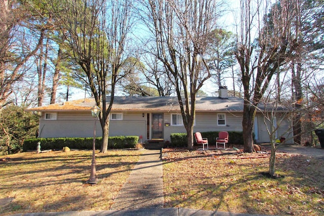 ranch-style house with a front yard