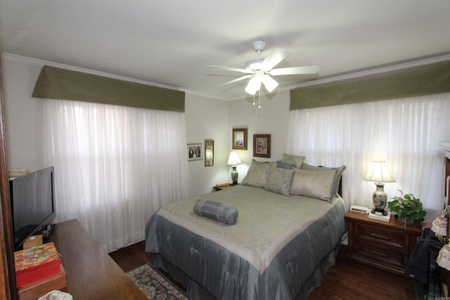 bedroom with ceiling fan, dark hardwood / wood-style floors, and ornamental molding