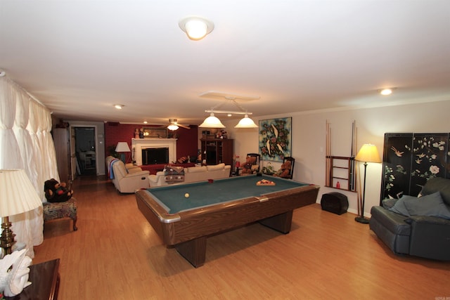 recreation room featuring ceiling fan, billiards, wood-type flooring, and crown molding