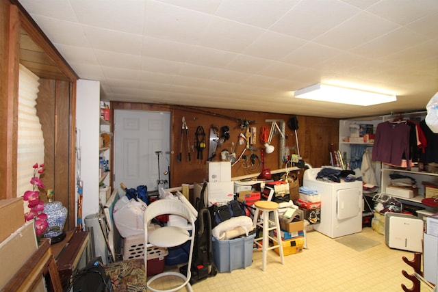 basement with washer / dryer and wood walls