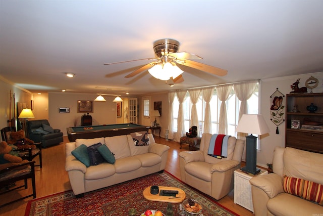 living room with crown molding, pool table, and hardwood / wood-style flooring