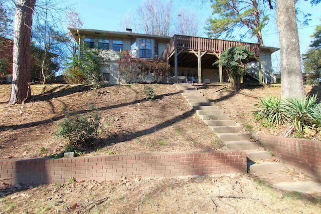 view of front facade with a wooden deck