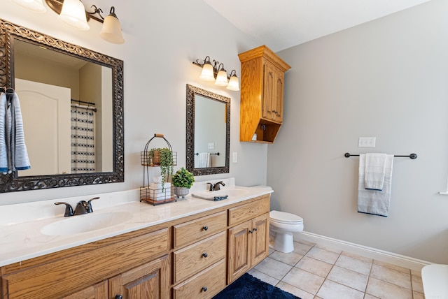 bathroom featuring toilet, a shower with shower curtain, tile patterned flooring, and vanity