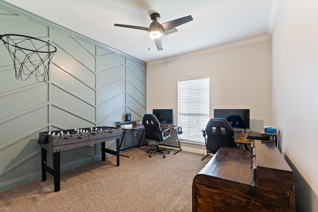 office area with carpet floors, ornamental molding, and ceiling fan