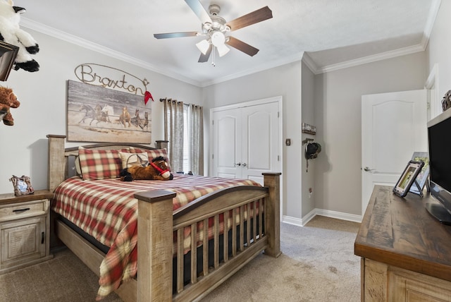 carpeted bedroom with ceiling fan and ornamental molding