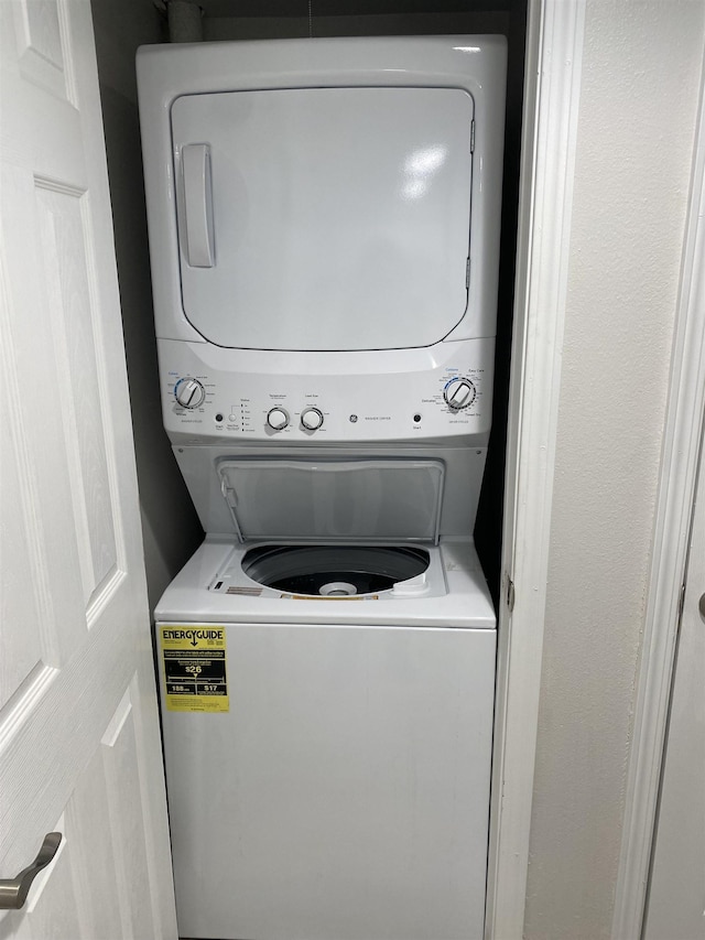 washroom with stacked washer and clothes dryer