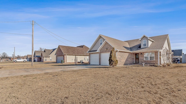 view of front of home featuring a garage and a front lawn