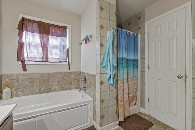 bathroom with plus walk in shower, tile patterned flooring, and vanity