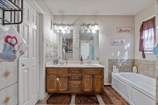 bathroom featuring vanity and a bathing tub