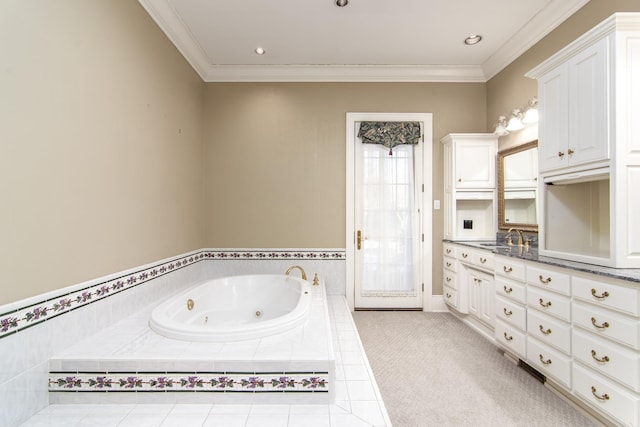 bathroom with tiled bath, vanity, and crown molding