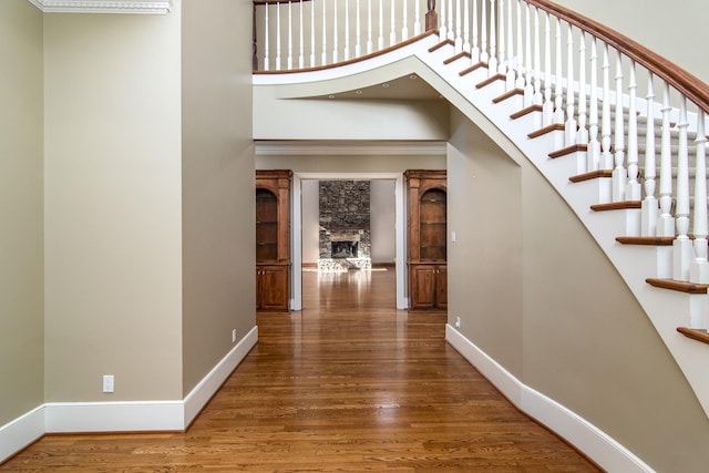 interior space with a high ceiling and hardwood / wood-style floors