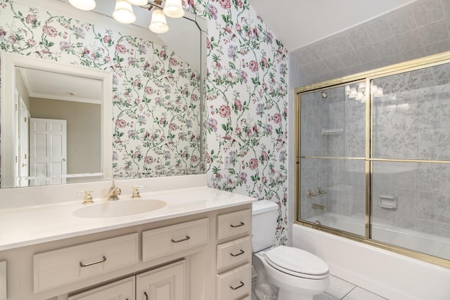 full bathroom featuring toilet, vanity, tile patterned floors, crown molding, and shower / bath combination with glass door