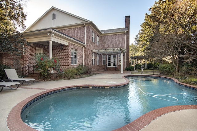 view of pool featuring a pergola and a patio