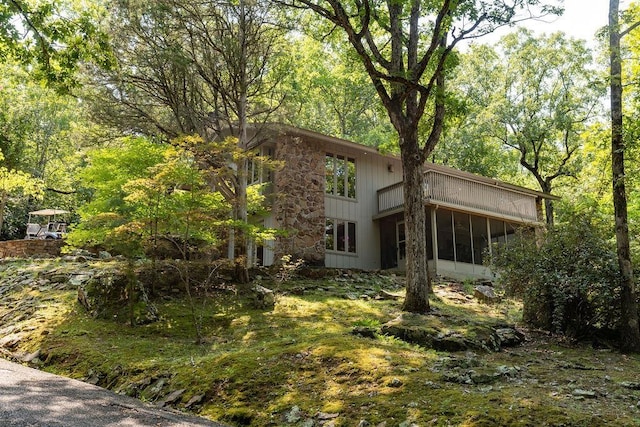 back of house with a sunroom