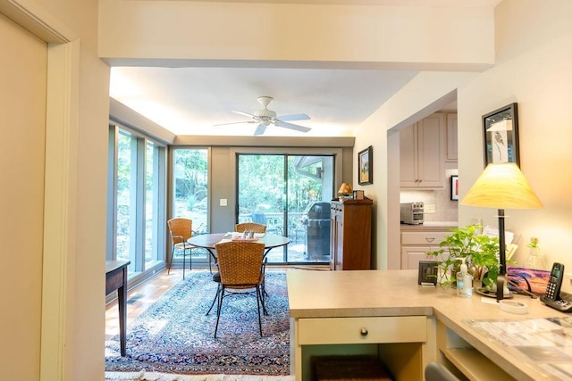 dining space featuring ceiling fan