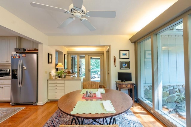 dining room featuring ceiling fan and light hardwood / wood-style flooring