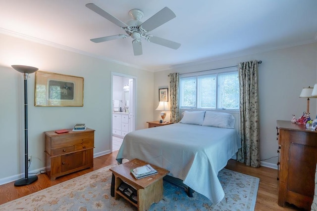 bedroom with ceiling fan, wood-type flooring, connected bathroom, and ornamental molding