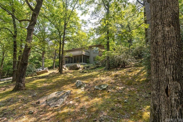 view of yard with a sunroom