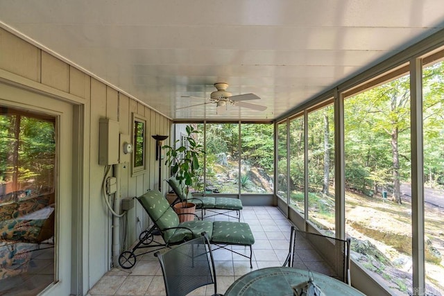 unfurnished sunroom with ceiling fan and a wealth of natural light