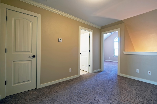 carpeted empty room with crown molding