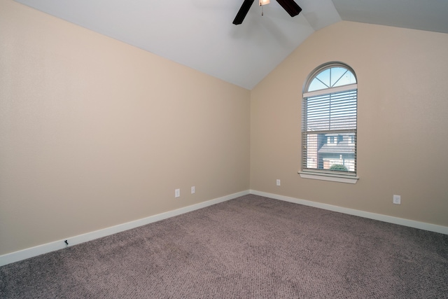 carpeted empty room featuring ceiling fan and lofted ceiling