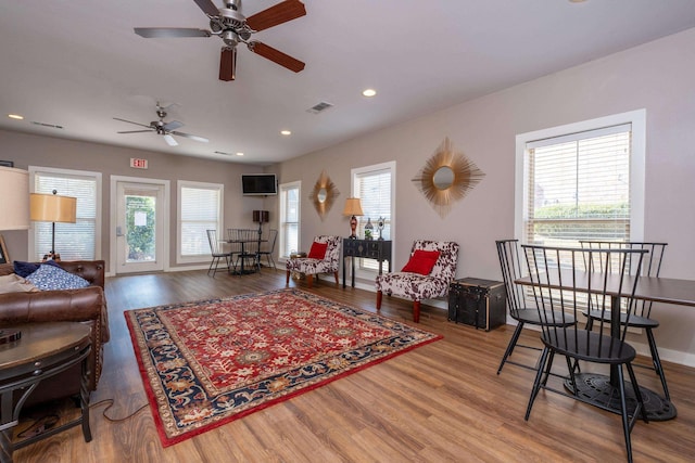 living room with a wealth of natural light and hardwood / wood-style floors