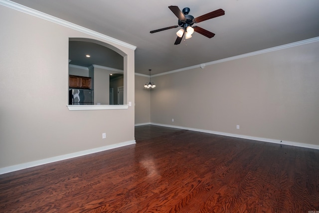 spare room featuring ceiling fan with notable chandelier, dark wood-type flooring, and ornamental molding