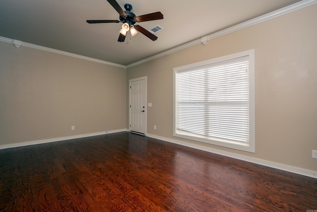 spare room featuring ceiling fan, dark hardwood / wood-style flooring, and crown molding