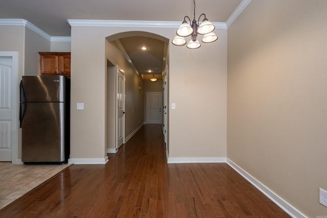 hall with dark hardwood / wood-style floors and crown molding