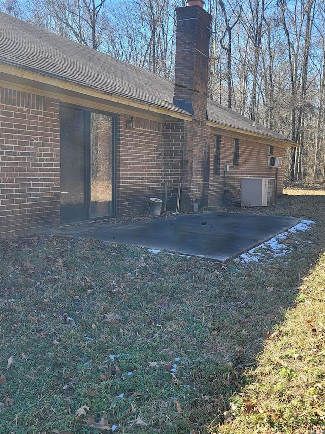 rear view of property featuring a patio