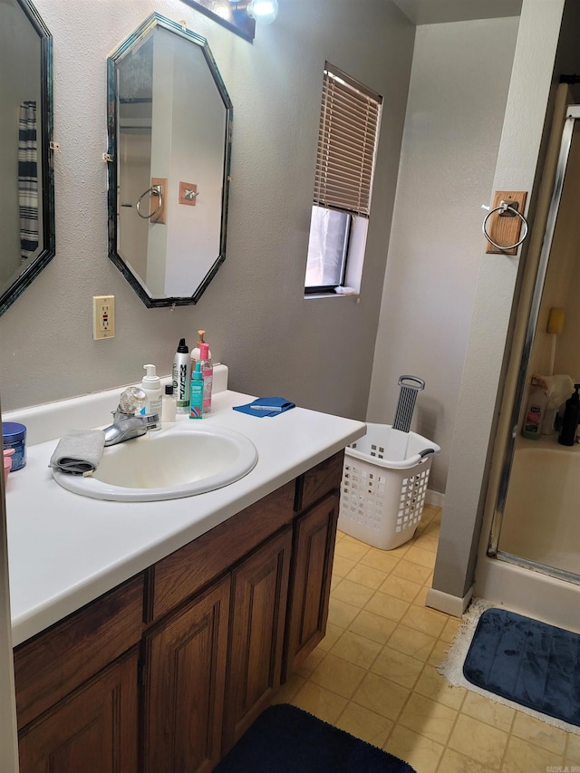 bathroom with tile patterned floors, vanity, and separate shower and tub