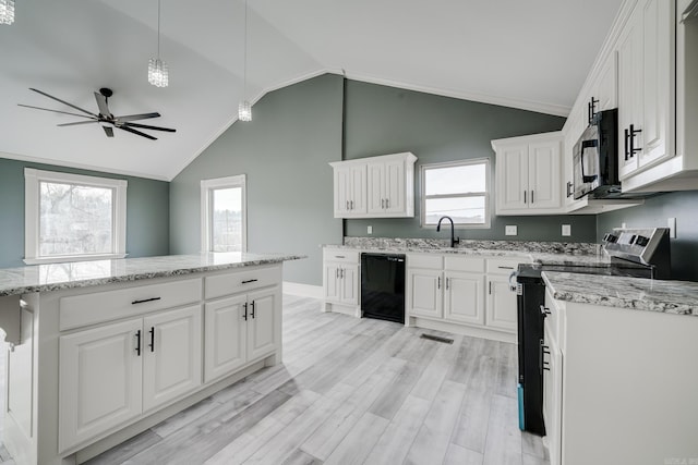 kitchen with pendant lighting, black appliances, white cabinetry, plenty of natural light, and vaulted ceiling