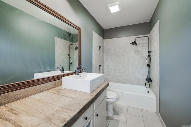 full bathroom with toilet, tile patterned floors, tiled shower / bath, and vanity