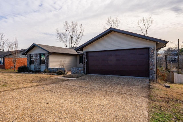 ranch-style home featuring a garage