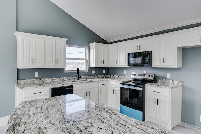 kitchen with white cabinets, black appliances, sink, ornamental molding, and vaulted ceiling