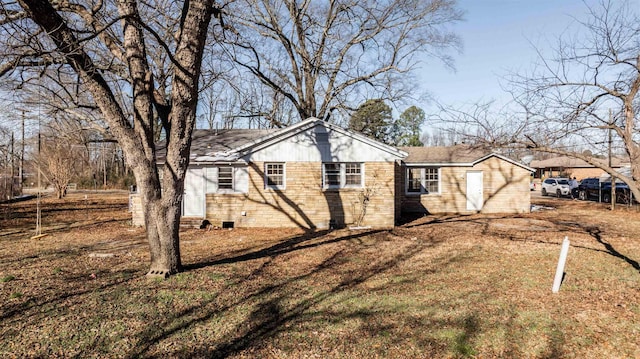 view of home's exterior with a lawn