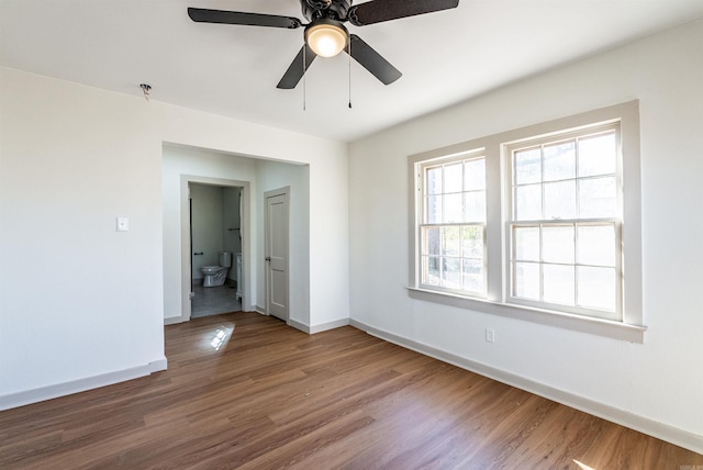 empty room with hardwood / wood-style floors