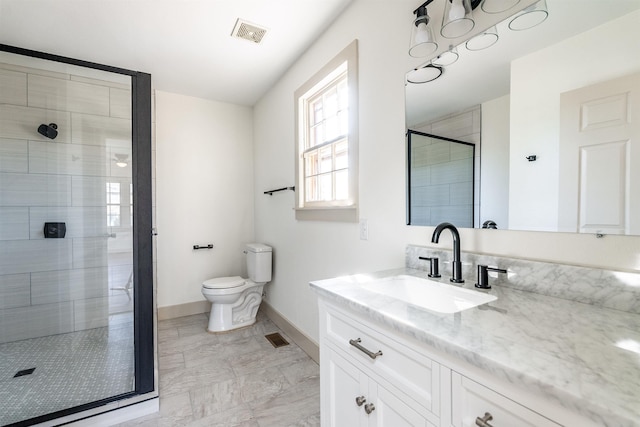 bathroom featuring toilet, walk in shower, and vanity