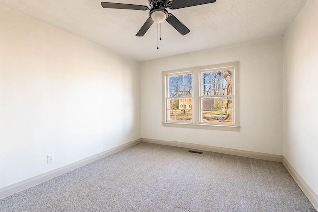 unfurnished room featuring carpet and ceiling fan