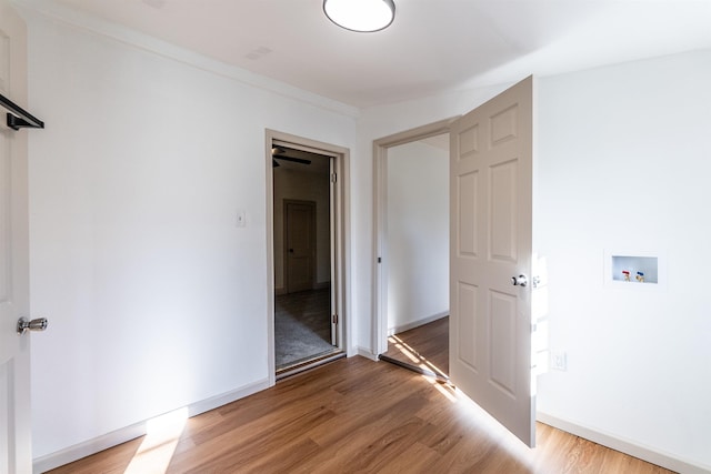 unfurnished bedroom featuring hardwood / wood-style floors