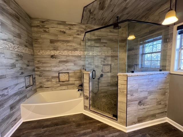 bathroom with plus walk in shower and hardwood / wood-style floors