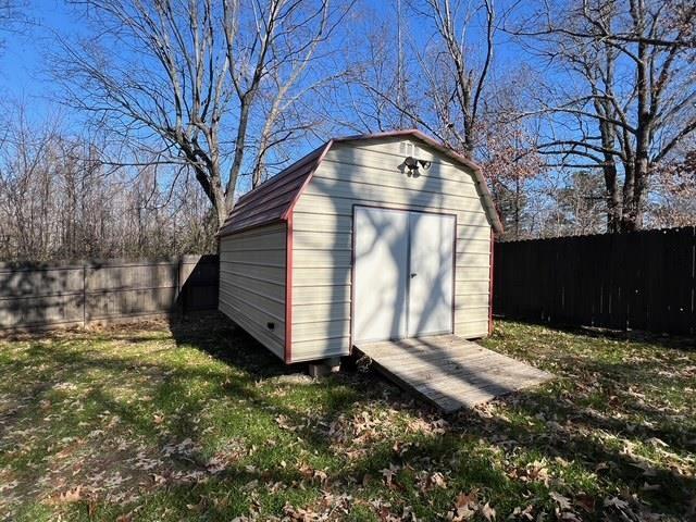 view of outdoor structure with a yard