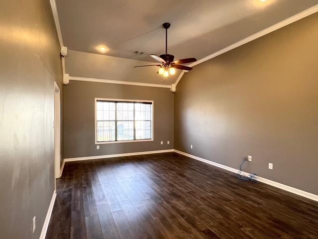 unfurnished room featuring vaulted ceiling, ceiling fan, dark hardwood / wood-style flooring, and crown molding