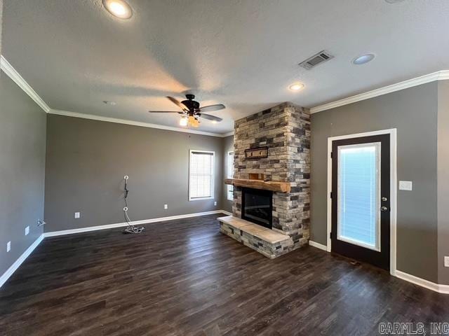 unfurnished living room featuring ceiling fan, a fireplace, crown molding, and dark hardwood / wood-style floors