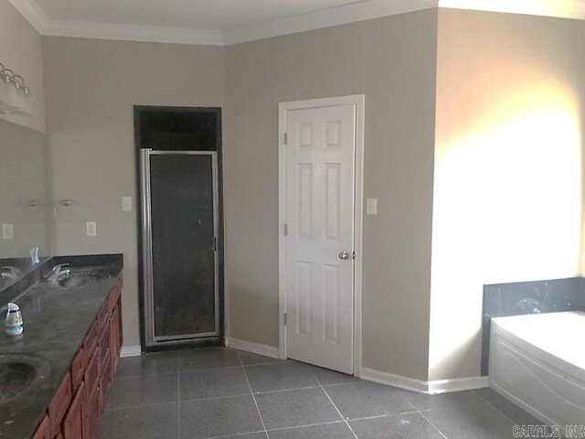 bathroom with vanity, tile patterned flooring, crown molding, and shower with separate bathtub