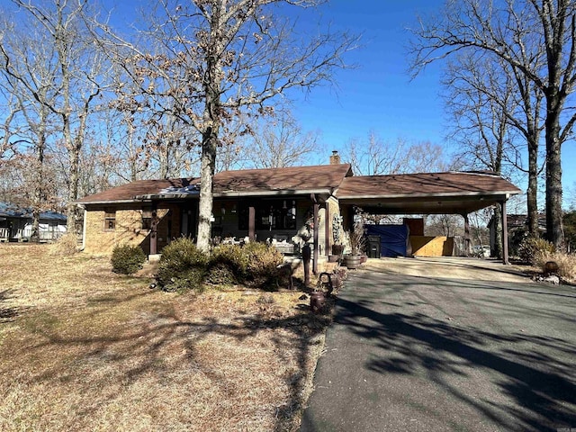 view of front of property with a carport