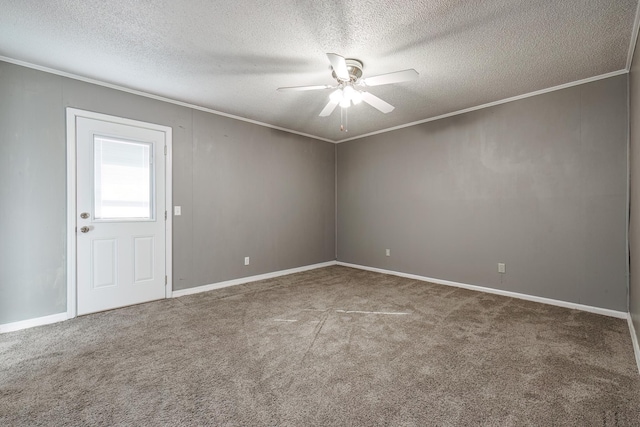 spare room featuring a textured ceiling, ceiling fan, carpet flooring, and ornamental molding