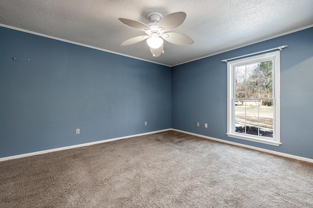 carpeted empty room with ceiling fan, a textured ceiling, and ornamental molding