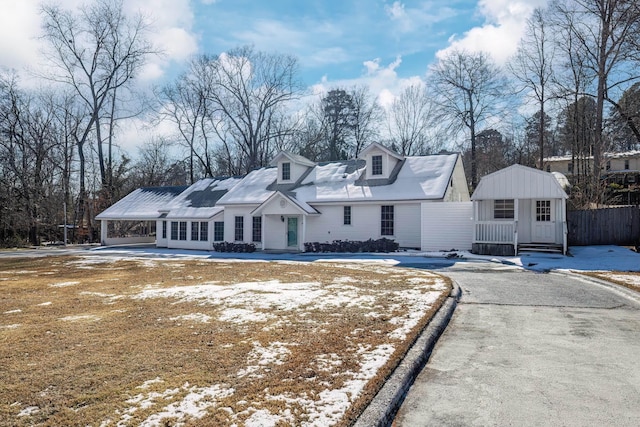 new england style home with a carport